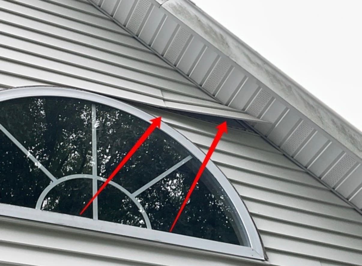 Soffit panel pulled away from the fascia at a gable end, flagged during a home inspection